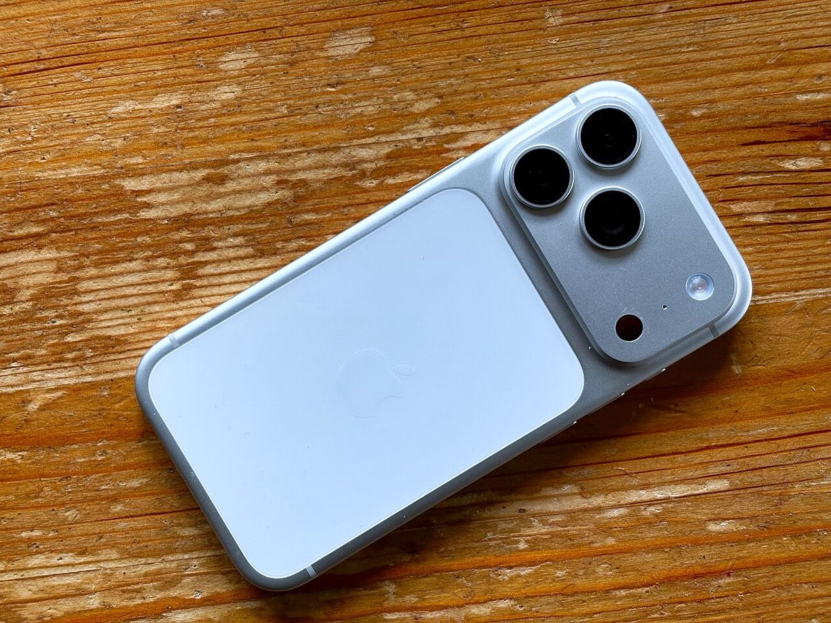 iPhone 17 Pro in blue, rear view showing the triple-camera module