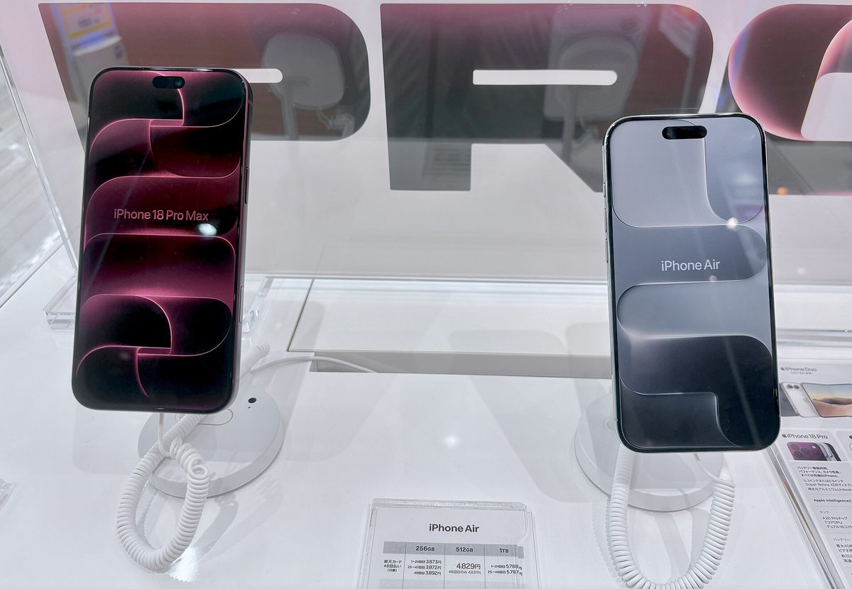 iPhone 18 Pro Max (burgundy, left) on display with its on-screen model name visible, next to an iPhone Air