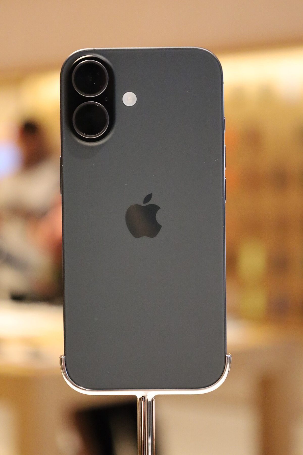Black iPhone 17, rear view, on display at the iPhone 17 launch in Kuala Lumpur
