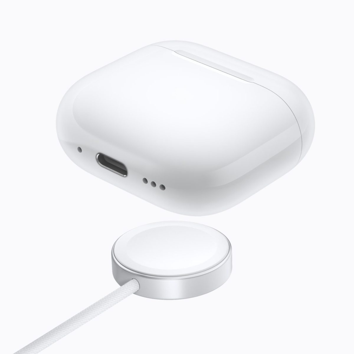 AirPods 5 Wireless Charging Case with USB-C port above an Apple Watch charger