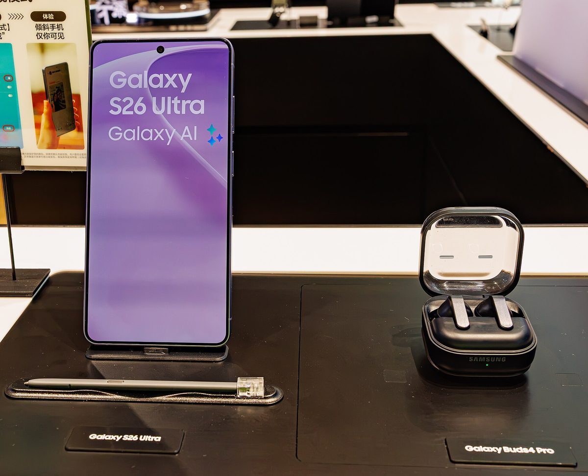 Samsung Galaxy S26 Ultra on display with its on-screen model name visible, next to the Galaxy Buds4 Pro