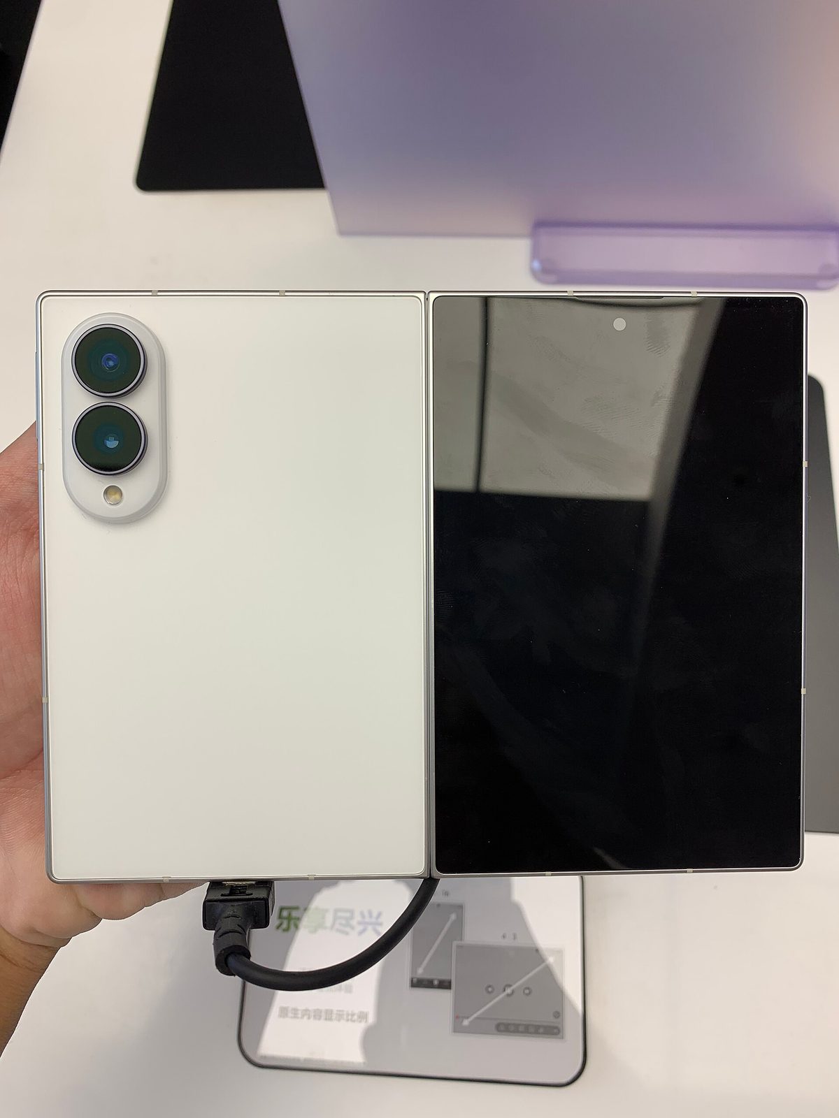 Samsung Galaxy Z Fold8 rear panel showing its dual-camera module, next to the unfolded cover display