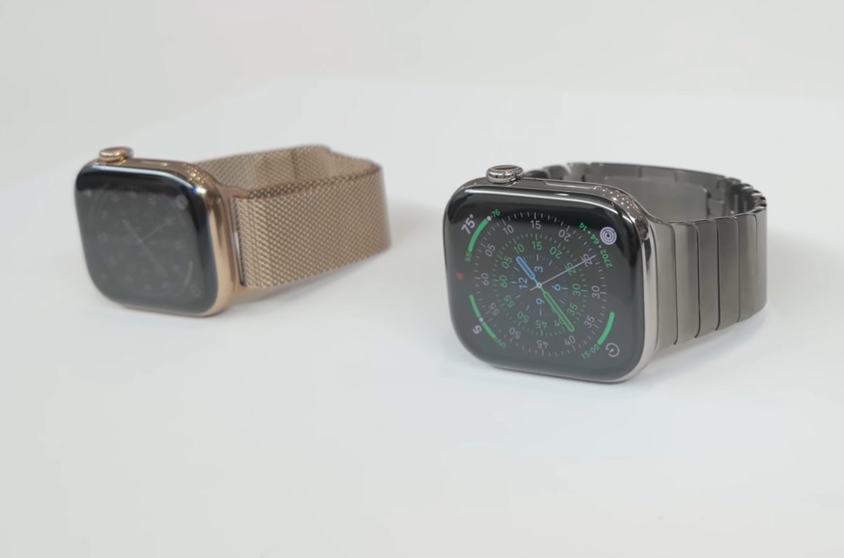 Two Apple Watch Series 11 units, gold stainless steel and titanium, with metal link bands